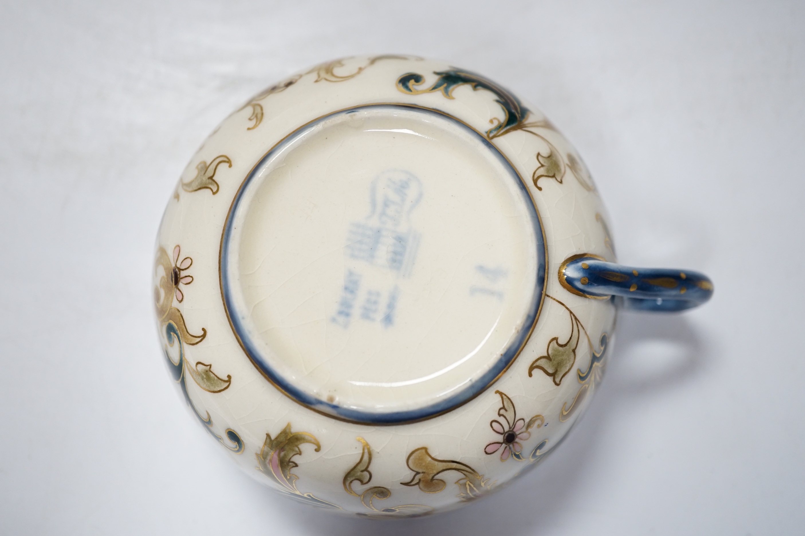 A Zsolnay teapot, teacup and sugar bowl, tallest 22cm